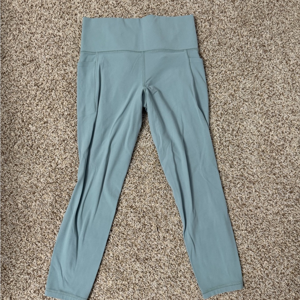 Athleta Salutation Stash Pocket 7/8 Tight